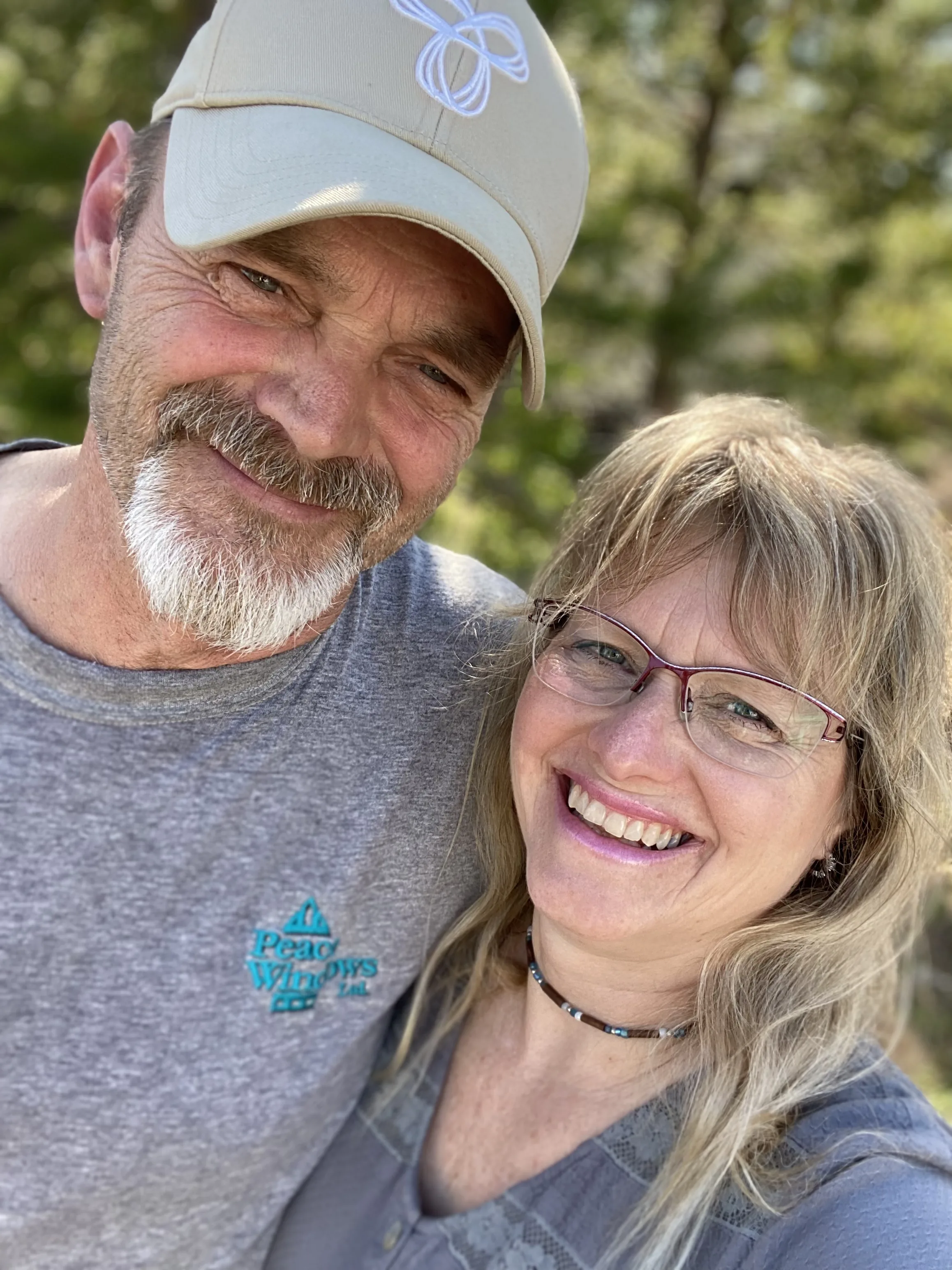 Tim and Tammy, owners of Chosen Holistic Services, smiling together outdoors